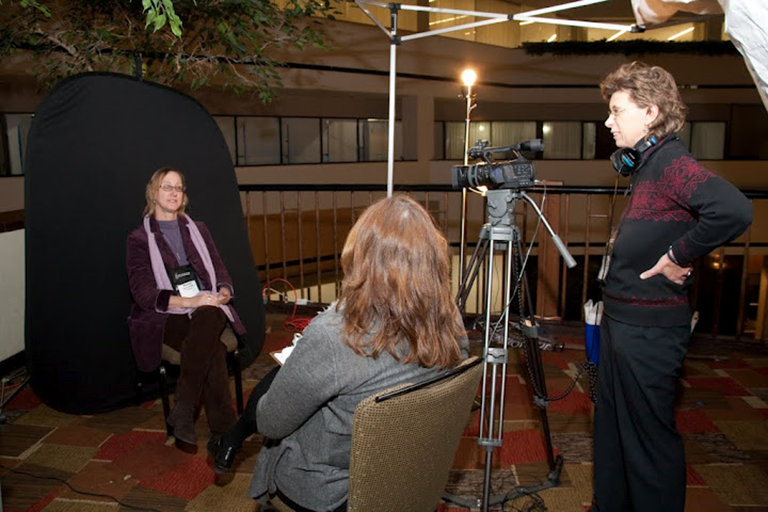 Photo of Center for Health Equity staff interviewing a person
