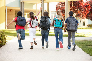 Young students headed into school building