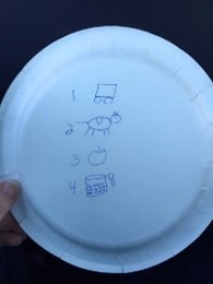 First-Then Schedule drawn on back of paper plate
