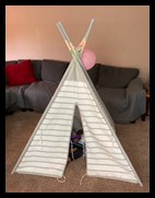 The picture below is of a teepee the child has at home that she can go into and sit with a favorite toy to play or relax.